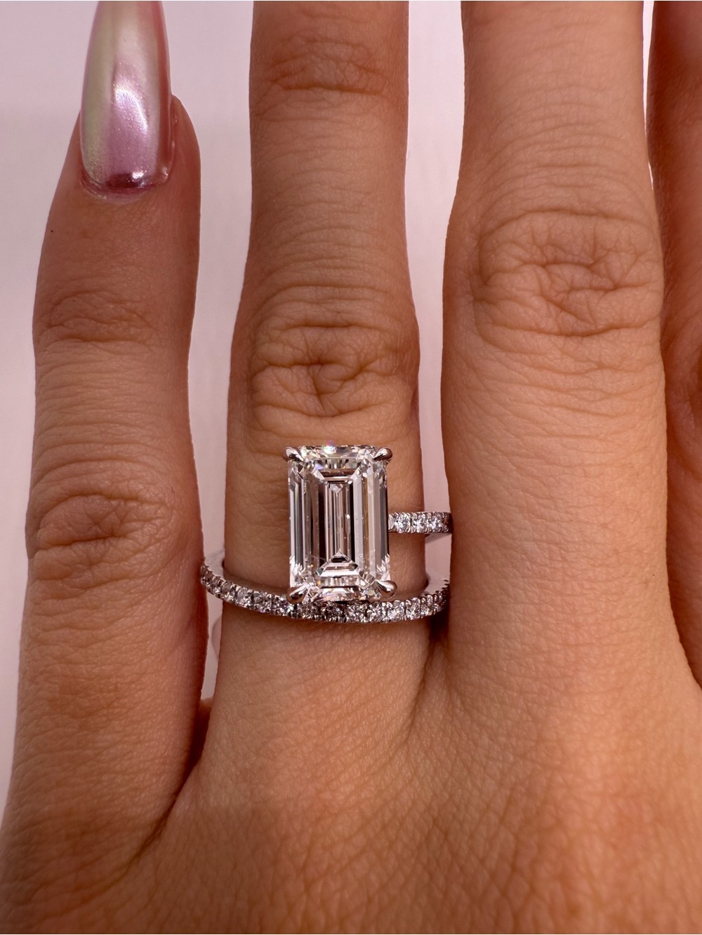 3.03 carat F VS1 emerald cut lab diamond on a pave band engagement ring
